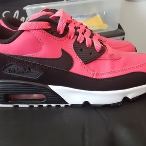 Hot pink and black Nike shoes